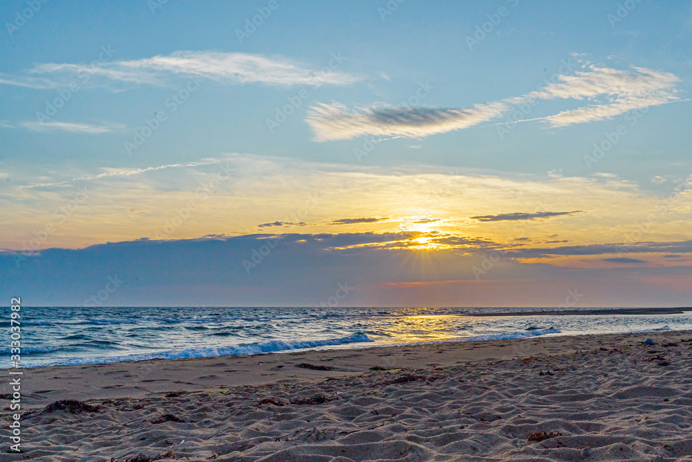 Wall mural sunset on the beach on north side of the provincelands cape cod, atlantic ocean view ma us.