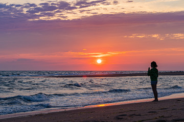 Fototapeta na wymiar Sunset on the beach on north side of the Provincelands Cape Cod, Atlantic ocean view MA US.