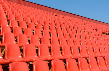 Spectator bleachers on an open soccer field. Stadium for summer football matches. Outdoor stadium