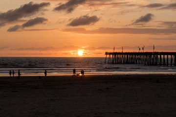 Wonderful view of the sunset and the pier in the city of Pismo Beach, California, USA. Golden hour.