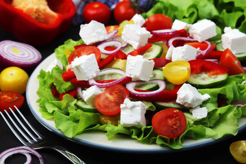 A plate full of bright fresh vegetable salad