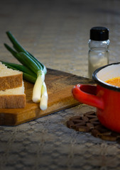 Bowl of bean soup with onion and bread