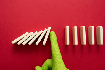 Domino effect. Physical distancing. Avoiding close contact