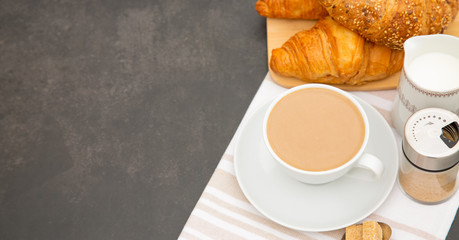 Breakfast Served in the morning with Hot black coffee and croissants Natural corn flake breakfast cereal in cups and fruit on the breakfast table every day