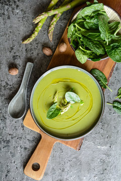 Creamy asparagus and spinach soup in a ceramic plate