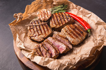 grilled meat medallions grilled vegetables dark background craft bbq