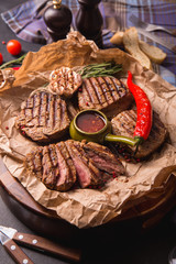 grilled meat medallions grilled vegetables dark background craft bbq