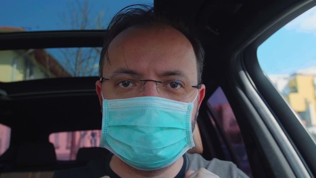 Portrait Of A Man Putting On His Medical Mask. Man Prevent Coronavirus Contamination Wearing Mask All Time.