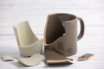 Broken Plate or broken glass and dish on the on the floor in the kitchen The concept of accidents in the kitchen is dangerous for the body and young children inside the house.