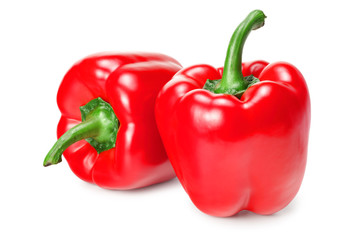 two red sweet bell peppers isolated on white background