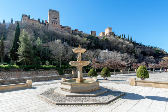 Paseo de los Tristes parallel to the river Darro and at the foot of the Alhambra Palace.