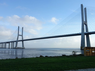 The Vasco de Gama Bridge Lisbon crosses the river Tejo on a cloudy day.