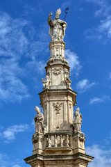 Fototapeta na wymiar The Baroque column Guglia di Sant'Oronzo in Ostuni, Puglia, Italy