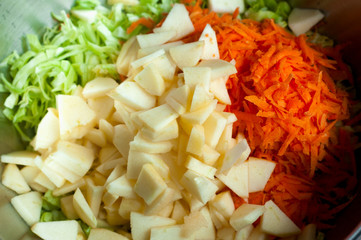 fresh salad of carrot and cabbage apples