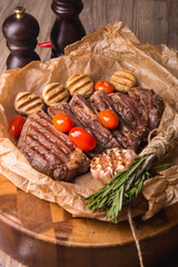 grilled meat medallions grilled vegetables dark background craft bbq