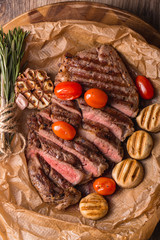 grilled meat medallions grilled vegetables dark background craft bbq