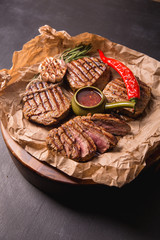 grilled meat medallions grilled vegetables dark background craft bbq