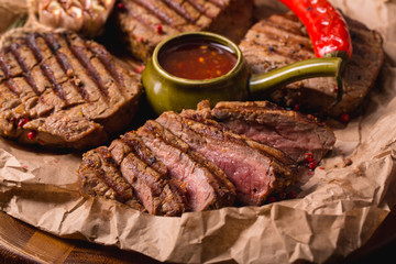 grilled meat medallions grilled vegetables dark background craft bbq