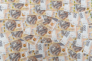 Obraz premium Background made from the front side of the Polish 200 PLN banknote, background for finance and economics.