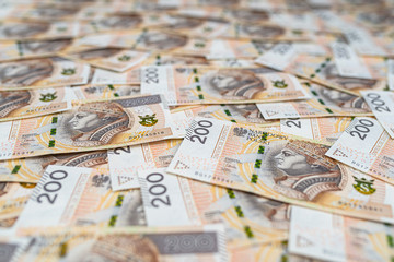 Background made from the front side of the Polish 200 PLN banknote, background for finance and economics.