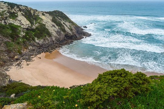 Adegas beach, in Aljezur, Portugal. Naturism beach surrounded by cliffs