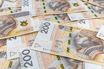 Background made from the front side of the Polish 200 PLN banknote, background for finance and economics.