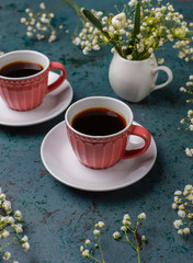 Victoria sponge cake slices with a cup of coffee on light background,top view