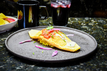 French omelette served with onion, cream and red sauce