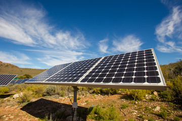 Close up wide angle view of photovoltaic solar panels on an off the grid electricity instalation on...
