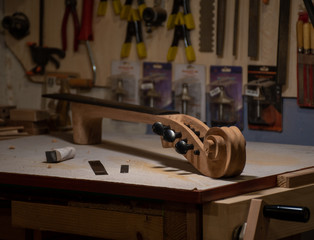cello neck finishing on the workbench