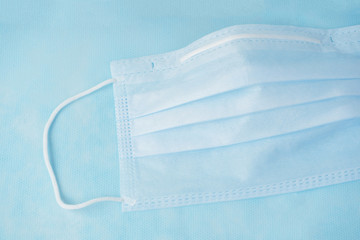 Medical mask of blue color for protection against flu and other diseases.