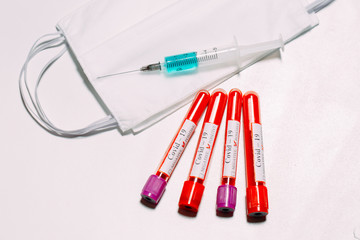 The vaccine for Coronavirus. Positive blood Tests for Coronavirus in test tubes.