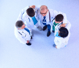 Fototapeta na wymiar Medical team sitting and discussing at table, top view