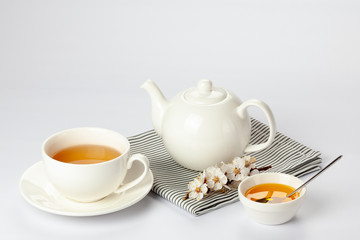 Porcelain tea set on white background