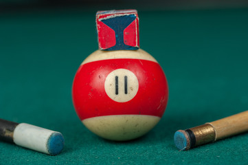 Billiards balls and cue on billiards table. Billiard sport concept.
