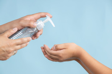 Woman applying an antibacterial antiseptic gel for hands disinfection and health protection during flu virus outbreak. Coronavirus quarantine and covid-19