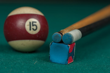 Billiards balls and cue on billiards table. Billiard sport concept.