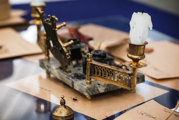 Bronze retro inkwell and ink red pen for writing