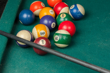 Billiards balls and cue on billiards table. Billiard sport concept.