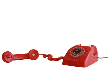 Vintage red telephone with off-hook handset white background