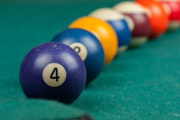 Billiards balls and cue on billiards table. Billiard sport concept.