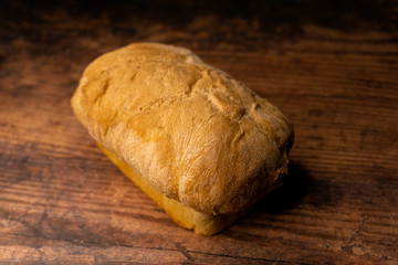 fresh baked bread oaf on a wood board