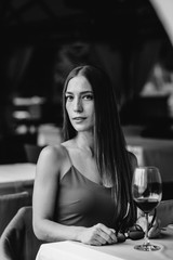 Sexy girl sitting on a beautiful veranda. Black and white.