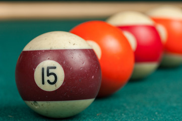 Billiards balls and cue on billiards table. Billiard sport concept.