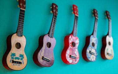 Small guitars on the house wall