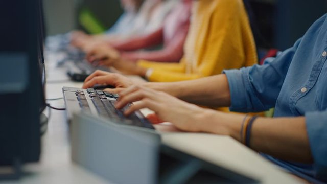 Row of Diverse Group of Multi-Ethnic People Works on PC. Office Team of Technical Support Staff Members Work on Computers, Help People Find Solutions. Anonymous Camera Shot focus On Hands