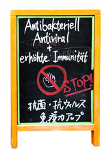 Wooden panel with text - Antibateriell, Antiviral und erhöhte Immunität - (engl. Antibacterial, Antiviral and increased immunity)