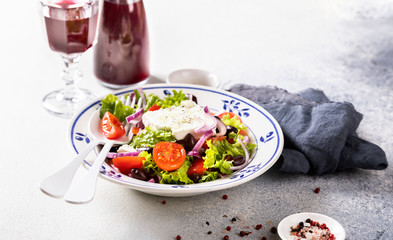 Greek salad of fresh vegetables, olives and feta. Traditional Mediterranean food.