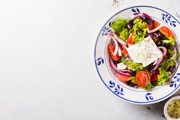 Greek salad of fresh vegetables, olives and feta. Traditional Mediterranean food.