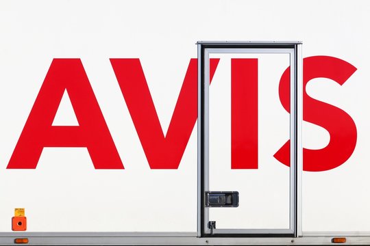 Tirstrup, Denmark - February 8, 2018: Avis logo on a truck. Avis is an American car rental company headquartered in New Jersey, United States